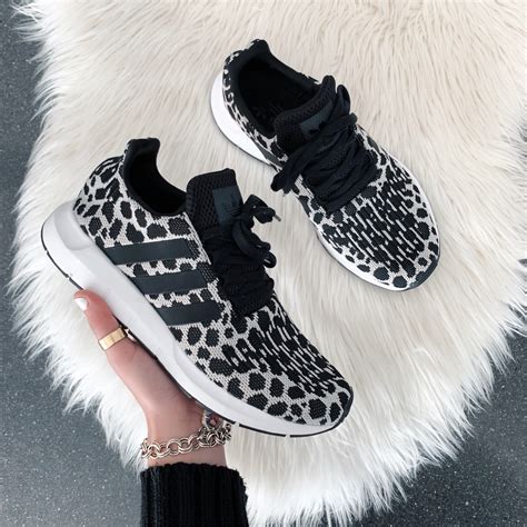 animal print adidas sneakers.